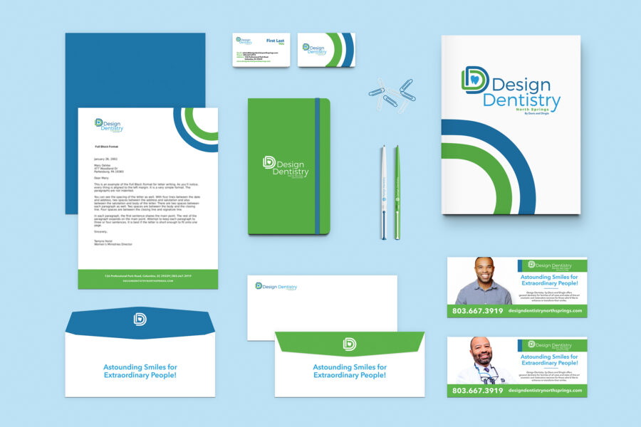 Mockup of Design Dentistry Branded Collateral designed by Streamlined Media & Communications including letterhead, envelopes, business cards, notebook, pens, folder, business card